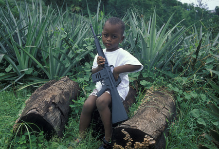 a child security at a Pinaple Plantation with a Gun the Island Praslin of the seychelles islands in the indian oceanのeditorial素材