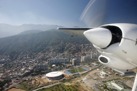 a airplane landing at the Caracas Airport at the coast of Caracas in the north of Venezuela.のeditorial素材