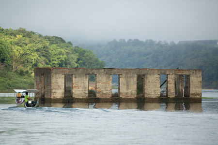 the floodet Wat Sam Prasop in the  landscape at the Khao Laem Lake in the Village of Sangkhlaburi north of the City of Kanchanaburi in Central Thailand in Southeastasia.のeditorial素材