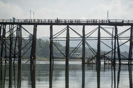 the Wang Kka Wooden Bridge in the  landscape at the Khao Laem Lake in the Village of Sangkhlaburi north of the City of Kanchanaburi in Central Thailand in Southeastasia.のeditorial素材
