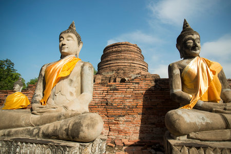 a buddha at the Wat yai chai mongkhon in the city of Ayutthaya north of bangkok in Thailand in southeastasia.の写真素材