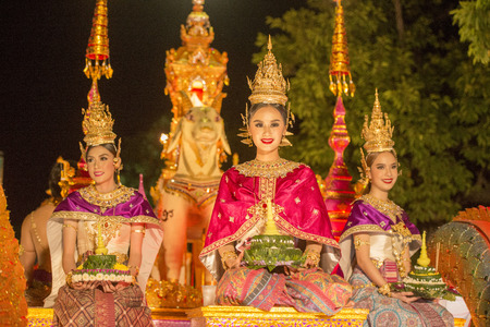 traditional dresst people at the night parade at the Loy Krathong Festival in the city of Chiang Mai in North Thailand in Thailand in southeastasia.のeditorial素材