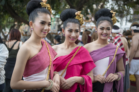 traditional dresst people at the night parade at the Loy Krathong Festival in the city of Chiang Mai in North Thailand in Thailand in southeastasia.のeditorial素材