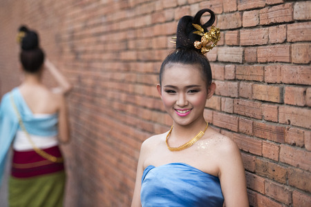 traditional dresst people at the night parade at the Loy Krathong Festival in the city of Chiang Mai in North Thailand in Thailand in southeastasia.のeditorial素材