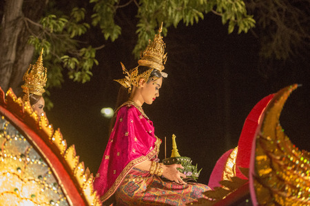 traditional dresst people at the night parade at the Loy Krathong Festival in the city of Chiang Mai in North Thailand in Thailand in southeastasia.のeditorial素材