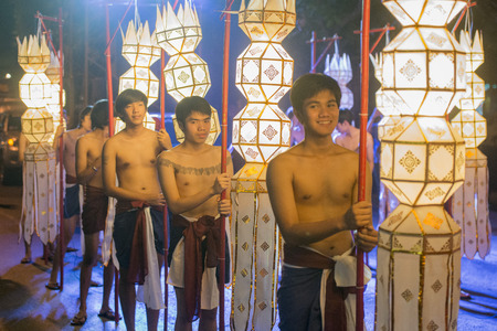 Lanterns and traditional dresst people at the night parade at the Loy Krathong Festival in the city of Chiang Mai in North Thailand in Thailand in southeastasia.のeditorial素材