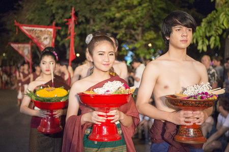 traditional dresst people at the night parade at the Loy Krathong Festival in the city of Chiang Mai in North Thailand in Thailand in southeastasia.のeditorial素材