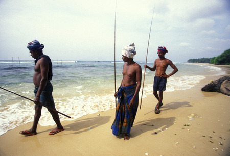 Fishermen at the coast of Weligama in the southwest of Sri Lanka in Asien.のeditorial素材