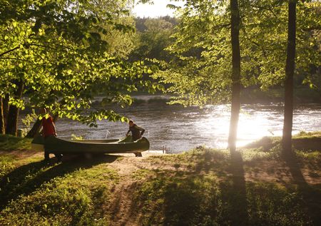 people on a canue trip on the gauja river near the town of sigulda near city of riga in latvia in the baltic region in europe.のeditorial素材