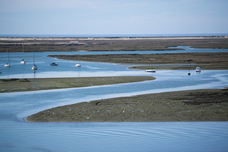 the Landscape of Ria Formosa at the coast of of Faro at the east Algarve in the south of Portugal in Europe.の写真素材