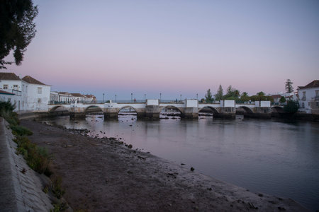 The Bridge Ponte Romana in the old town of Tavira at the east Algarve in the south of Portugal in Europe.の写真素材