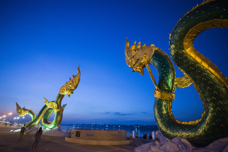 a Phayanak or Naga Statue at the mekong river in the town of Nong Khai in Isan in north east Thailandのeditorial素材