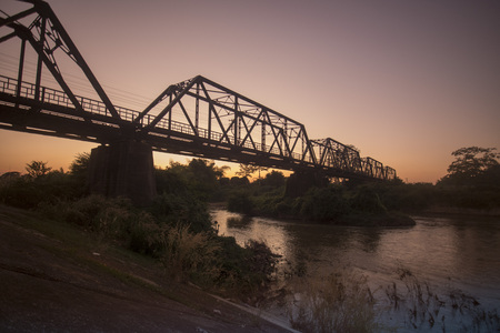 the railway bridge of the world war 2 at the wang river in the city of Lampang in North Thailand.の写真素材