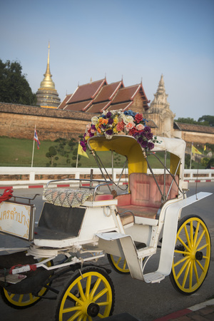 a horse carriage at the Wat Prathat Lampang Luang near of the city of Lampang in North Thailand.のeditorial素材
