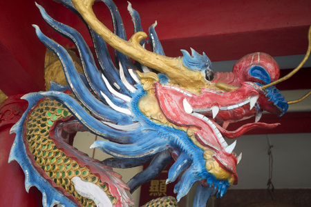 a chinese Dragon in a Chinese Temple in the old town of the city of Lampang in North Thailand.のeditorial素材
