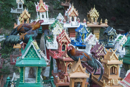 the Spirit Houses on a Pass on the way from Lampang to Mae Tha north of the city of Lampang in North Thailand.の写真素材