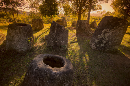 the plain of jars site 3 in the morning near the town of Phonsavan in the province Xieng Khuang in north Lao in southeastasia.の写真素材