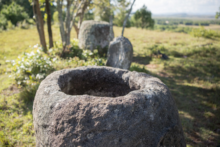 the plain of jars site 2 in the morning near the town of Phonsavan in the province Xieng Khuang in north Lao in southeastasia.の写真素材