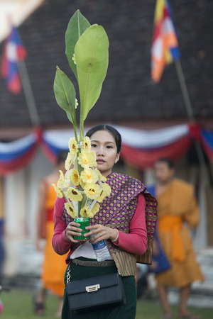 People at a ceremony at the Pha That Luang Festival in the city of vientiane in Laos in the southeast asia.のeditorial素材
