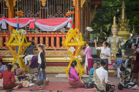 wax castle at a ceremony at the Wat Si Muang Temple on the That Luang Festival in the city of vientiane in Laos in the southeastasia.のeditorial素材