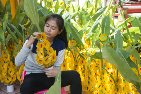wax castle at a ceremony at the Wat Si Muang Temple on the That Luang Festival in the city of vientiane in Laos in the southeast asia.のeditorial素材
