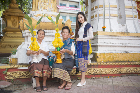 wax castle at a ceremony at the Wat Si Muang Temple on the That Luang Festival in the city of vientiane in Laos in the southeast asia.のeditorial素材