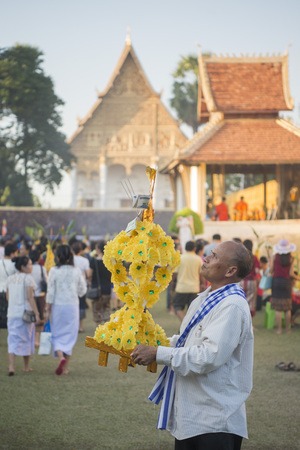 People at a ceremony at the Pha That Luang Festival in the city of vientiane in Laos in the southeastasia.のeditorial素材