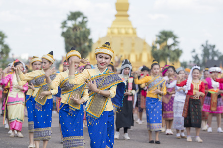 Traditional dress People at a ceremony at the Pha That Luang Festival in the city of vientiane in Laos in the southeastasia.のeditorial素材