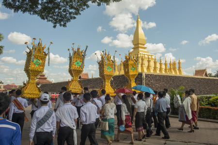 People at a ceremony at the Pha That Luang Festival in the city of vientiane in Laos in the southeastasia.のeditorial素材