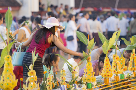 People at a ceremony at the Pha That Luang Festival in the city of vientiane in Laos in the southeastasia.のeditorial素材