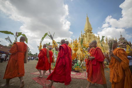 People at a ceremony at the Pha That Luang Festival in the city of vientiane in Laos in the southeastasia.のeditorial素材