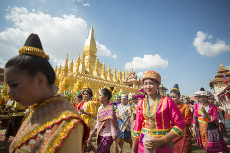Traditional dress People at a ceremony at the Pha That Luang Festival in the city of vientiane in Laos in the southeastasia.のeditorial素材