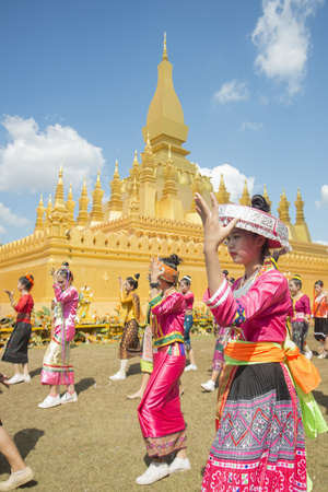Traditional dress People at a ceremony at the Pha That Luang Festival in the city of vientiane in Laos in the southeastasia.のeditorial素材