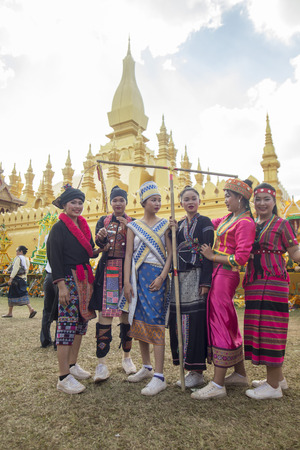 Traditional dress People at a ceremony at the Pha That Luang Festival in the city of vientiane in Laos in the southeastasia.のeditorial素材