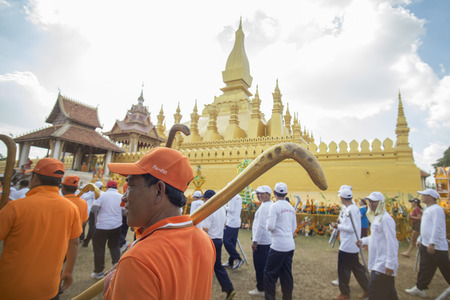 Traditional dress People at a ceremony at the Pha That Luang Festival in the city of vientiane in Laos in the southeastasia.のeditorial素材