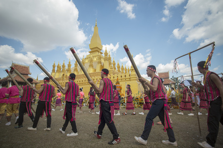 Traditional dress People at a ceremony at the Pha That Luang Festival in the city of vientiane in Laos in the southeastasia.のeditorial素材