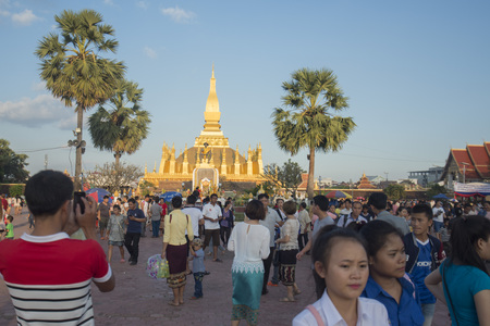 People at a ceremony at the Pha That Luang Festival in the city of vientiane in Laos in the southeastasia.のeditorial素材