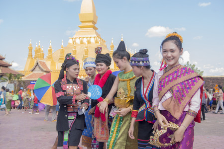 Traditional dress People at a ceremony at the Pha That Luang Festival in the city of vientiane in Laos in the southeastasia.のeditorial素材