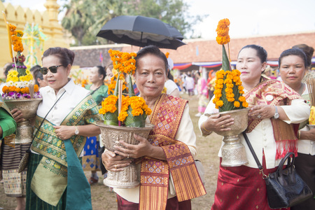 People at a ceremony at the Pha That Luang Festival in the city of vientiane in Laos in the southeastasia.のeditorial素材