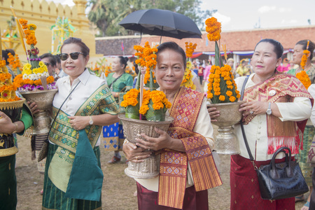 People at a ceremony at the Pha That Luang Festival in the city of vientiane in Laos in the southeastasia.のeditorial素材