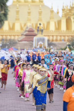 Traditional dress People at a ceremony at the Pha That Luang Festival in the city of vientiane in Laos in the southeastasia.のeditorial素材