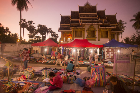 the nightmarket in front of the Wat Ho Pha Bang of the King Palace in the town of Luang Prabang in the north of Laos in Southeastasia.のeditorial素材