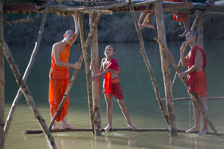 the construction of the Bamboo Bridge over the Nam Khan river in the town of Luang Prabang in the north of Laos in Southeastasia.のeditorial素材