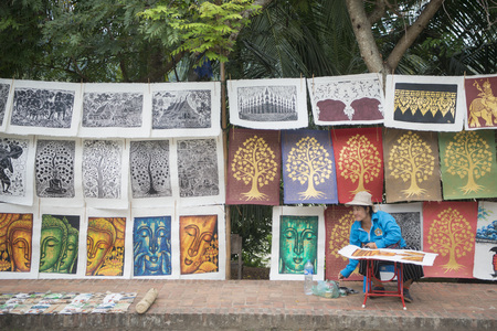 a painting artist in the town of Luang Prabang in the north of Laos in Southeastasia.のeditorial素材