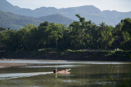 the Nam Khan river in the town of Luang Prabang in the north of Laos in Southeastasia.のeditorial素材