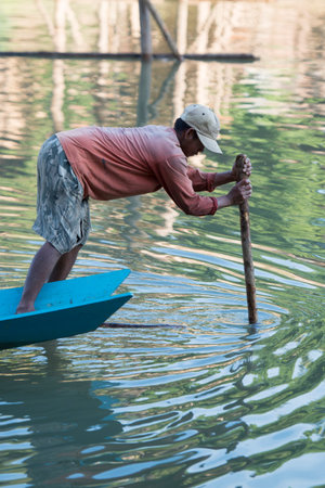the construction of the Bamboo Bridge over the Nam Khan river in the town of Luang Prabang in the north of Laos in Southeastasia.のeditorial素材
