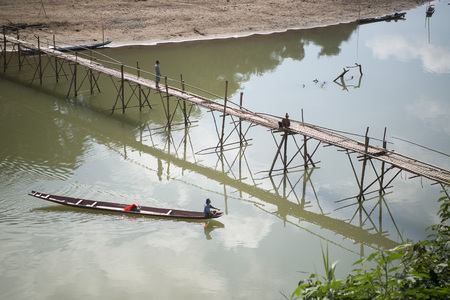 the construction of the Bamboo Bridge over the Nam Khan river in the town of Luang Prabang in the north of Laos in Southeastasia.のeditorial素材