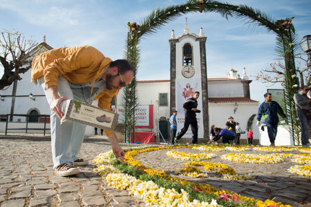the easter procession Festa das Tochas Flores in the town of Sao Bras de Alportel at the Algarve of...