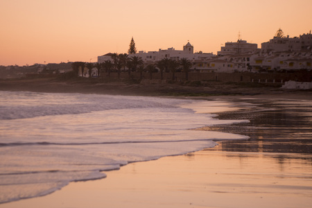 the beach at the village of Luz at the Algarve of Portugal in Europe.の写真素材