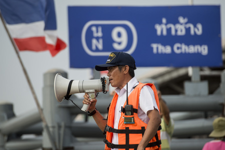 Loud Pasanger security at a pier at the chao phraya river in the city of Bangkok in Thailand.  Thailand, Bangkok, November, 2017のeditorial素材